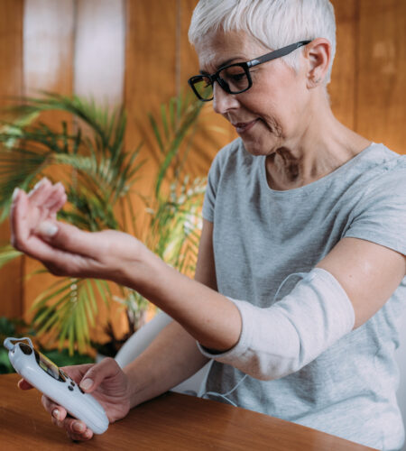 Senior woman doing elbow physical therapy