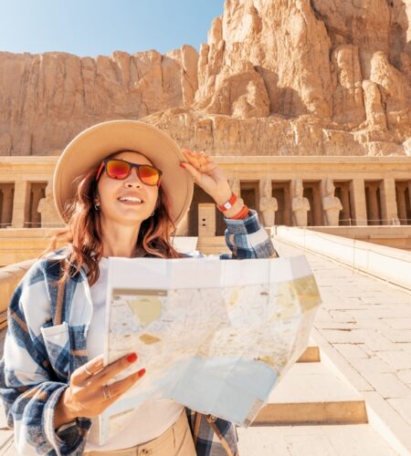 A girl tourist and traveler with a map