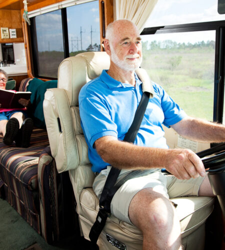 Senior couple traveling by motor home