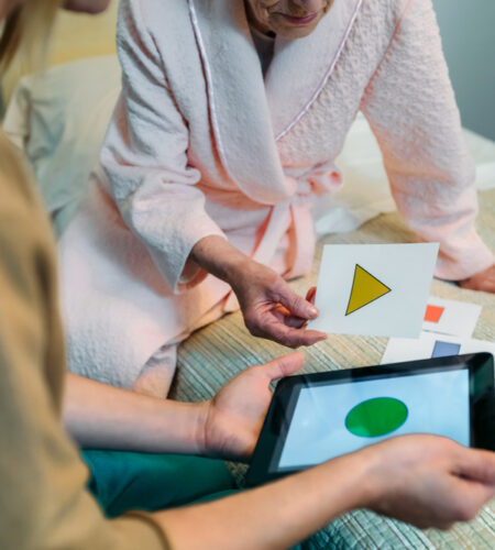 Female doctor showing geometric shape game